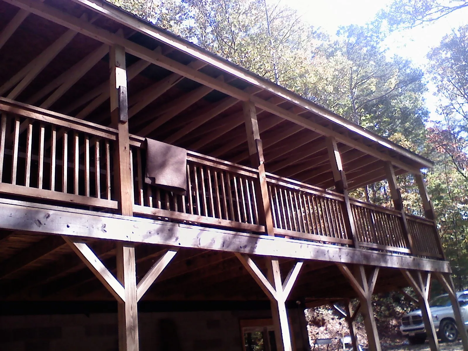 Timber framing under a new elevated porch and deck — Roof Leak Repair in Rush by Roofing Brothers